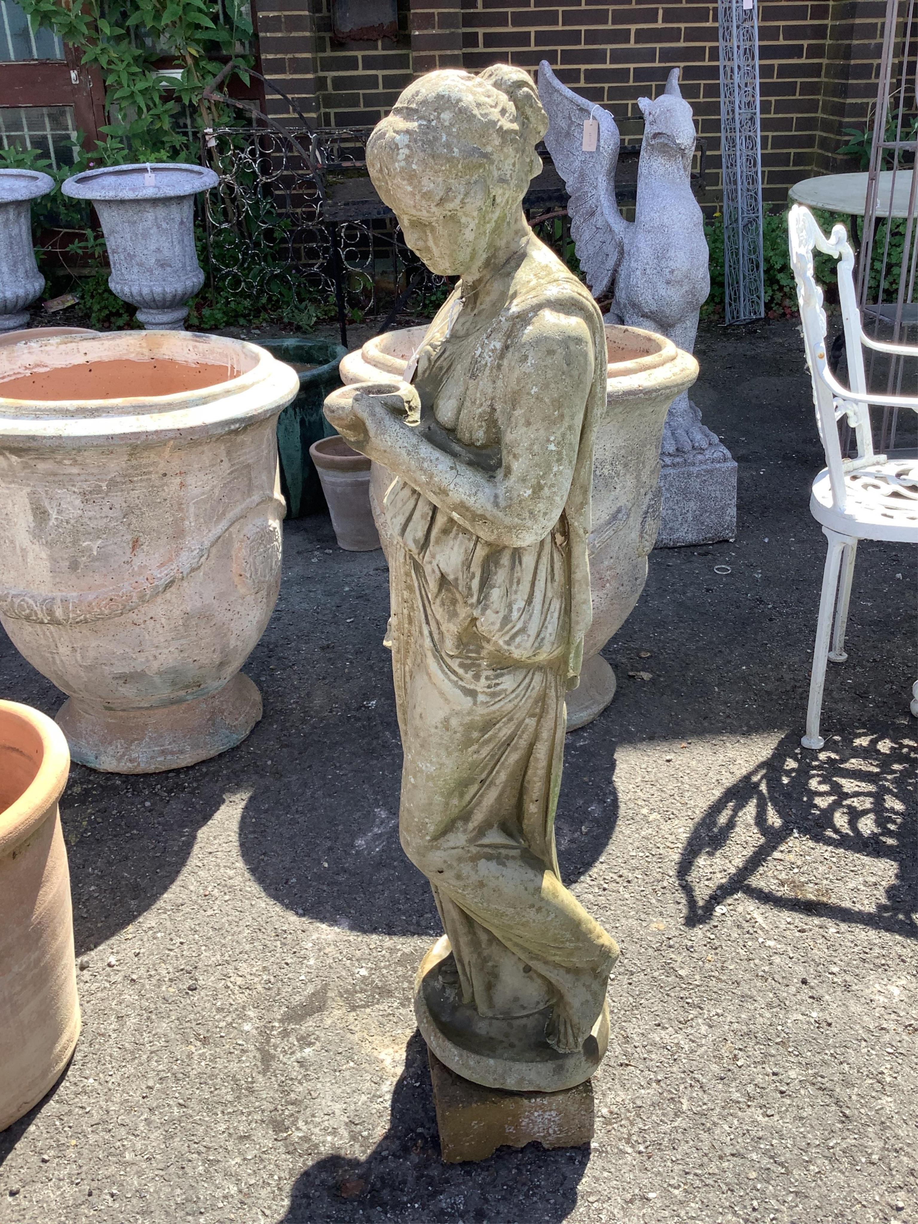 A reconstituted stone female water carrier garden ornament, height 106cm